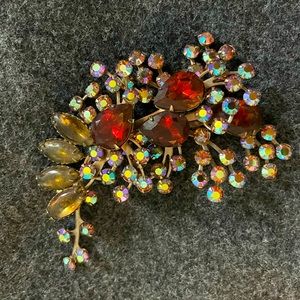 Crystal and brownish stones in a silver setting